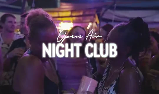 Guests at the Harbour Lights nightclub under evening lights